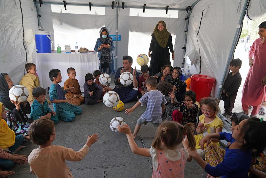 On August 14, 2021, children participate in a recreational activity at a UNICEF Child-Friendly Space at Peer Mohammad Kakar high school where more than 400 families are sheltering having fled instability and conflict to Kabul. 