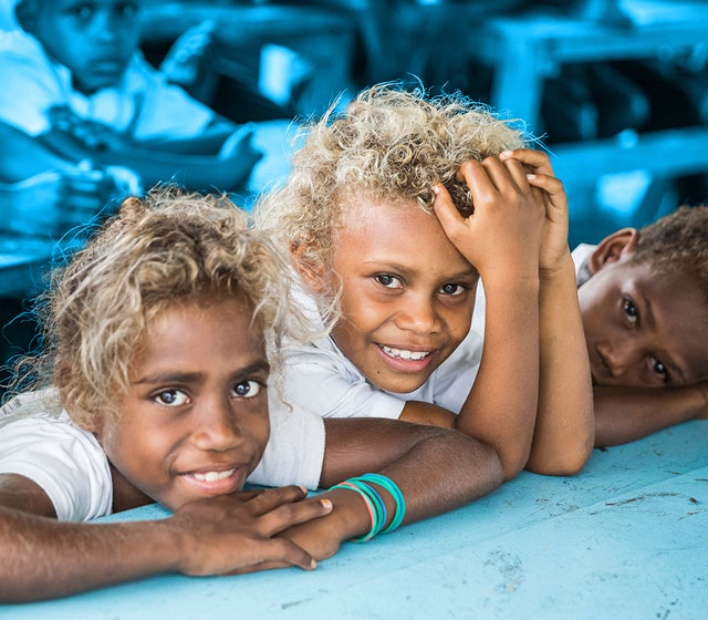 Students of Sali Primary School in Sali village, Guadalcanal Island, gather to greet UNICEF Pacific Representative Dr. Karen Allen and UNICEF Solomon Islands team, who came to their school to inaugurate new washing facilities, including school toilets. The funds for building the facilities were provided by Live&Learn Solomon Islands in partnership with UNICEF.