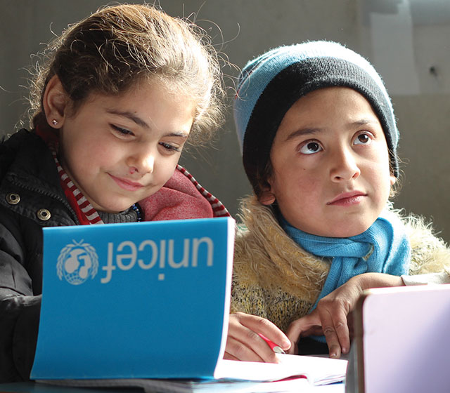 On 9 December 2016, children at Jibreen shelter attend basic preparation classes in 20 classrooms rehabilitated by UNICEF and other education sector partners. The makeshift school now welcomes 900 displaced children, bringing some critical structure, fun and routine back to their lives.