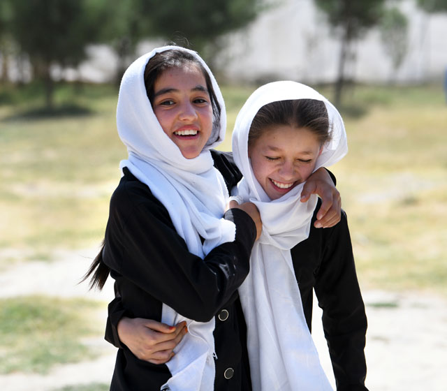 Students at the playground of Turgani High School in Faizabad, the largest city of Badakhshan, a northern province of Afghanistan. In Afghanistan 3.7 million children are out of school, girls comprise 60 percent of out-of-school children and only 54 percent of enrolled children complete primary school. 