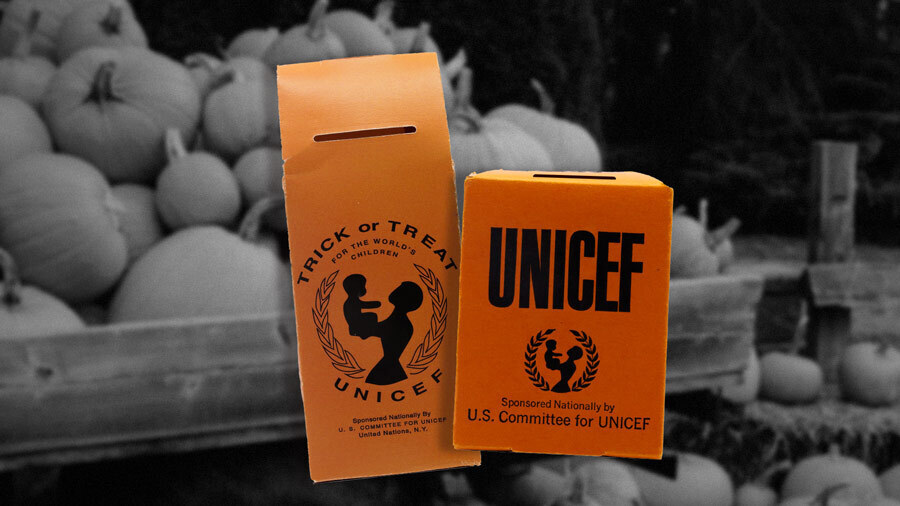 Two orange collection boxes, both with logo silhouette line art of a mother holding up her baby, the two people surrounded by a wreath of peace. One box has the text 'Trick-or-Treat for the world's children, UNICEF. The other says 'UNICEF, Sponsored Nationally by U.S. Committee for UNICEF.'