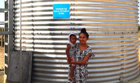 Estefany, a young mother of two in rural La Guajira, Colombia, works as a plumber in her village's locally managed, sustainable water treatment plant, built by UNICEF and partners.