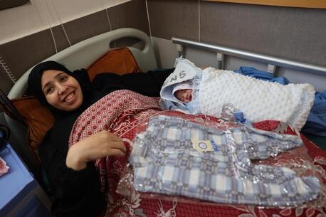 In the Gaza Strip in April 2024, Noura and her newborn, Majd, received essential baby supplies and baby clothes from UNICEF.