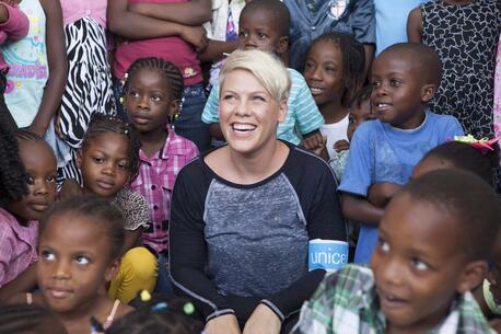 P!nk visits with children in Haiti in 2015 while traveling with UNICEF to see UNICEF programs in action.