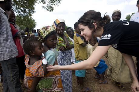 Selena Gomez, UNICEF Ambassador since 2009, greets children during a UNICEF program visit.