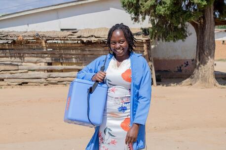 Loyce Msowoya, a health worker at St John's Hospital in Mzuzu, Malawi, carries a box of vaccines during a door-to door polio vaccination campaign on March 8, 2024. 