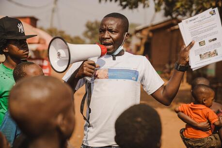 Innocent Murula, a UNICEF-supported community outreach worker, uses his megaphone to raise community awareness about mpox in Kamanyola, South Kivu province, Democratic Republic of the Congo, on July 25, 2024.