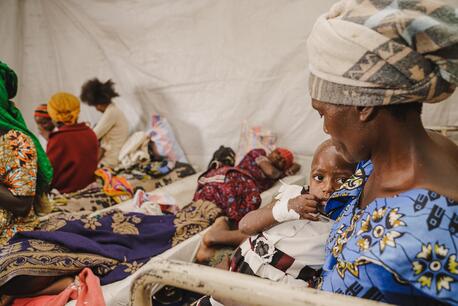 A mother holds her child suffering from mpox at the mpox isolation unit of the UNICEF-supported Kavumu Hospital in South Kivu province, Democratic Republic of the Congo (DRC), on July 23, 2024