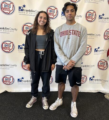 Two teenagers learning about civic engagement.