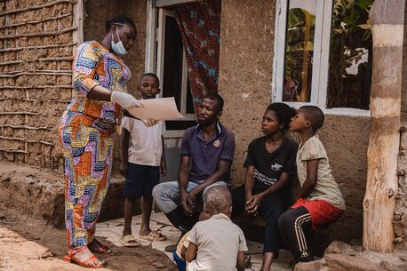 Mwamini Badesire, a community leader and UNICEF-supported community outreach worker, raises awareness about mpox symptoms and prevention measures with the Amani family in Chireja village, South Kivu province, DR Congo, on Sept. 13, 2024.