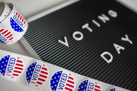 'I Voted' stickers and a sign that reads Voting Day.