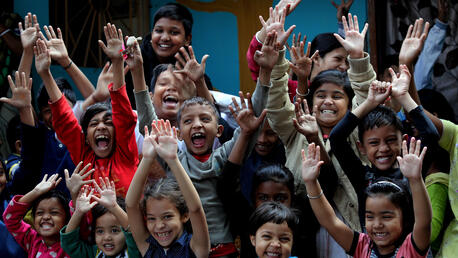 Children, under APW programme in Hela Para, Ward-86 in Kolkata, India are full of joy to wish the world a happy new year.