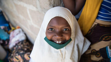 Young girl in house in the neighborhood of Paquitequete that hosted IDP, visit by UNICEF and European Union delegation. ©UNICEF/UN0364817/Franco