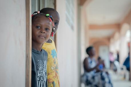 Tamara, 4, and Milen, 6, who were displaced when a tornado struck Bassin Bleu, in Haiti’s Northwest department, stand just outside their temporary home at a UNICEF-supported shelter. 