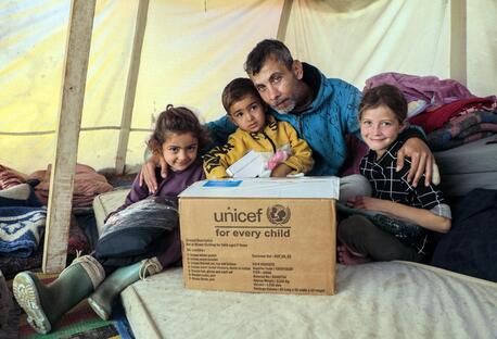 UNICEF and partners bring warmth to children in Khan Younis, Gaza Strip by distributing winter clothes to families in Algeria Camp and Al Amal Camp.