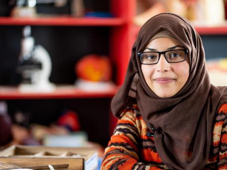 Bodoor, 17, in the science lab of her UNICEF-supported school in Jordan in 2018. She and her family fled violence in Syria and settled in Azraq Refugee Camp since 2014. 
