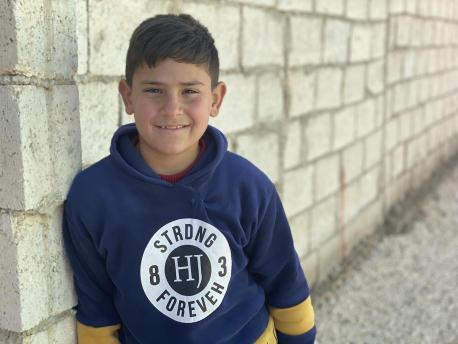 Ali, 10, is a Syrian refugee living in Mafraq, Jordan with his four brothers, two sisters and parents.