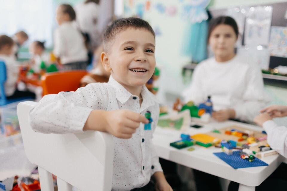 Misha, 6, plays with LEGO blocks at a UNICEF play and learning hub in Balti, Moldova. 