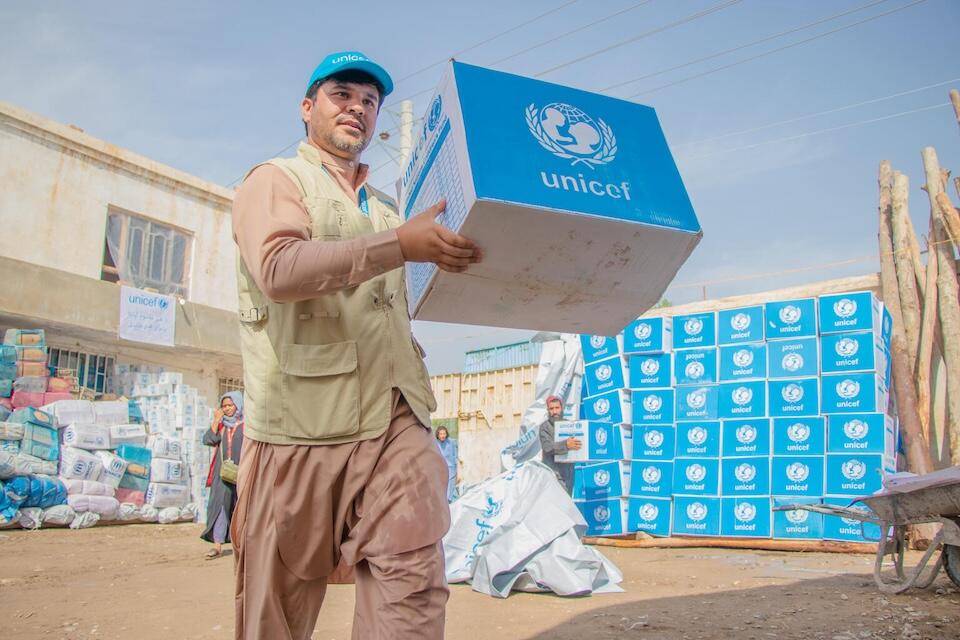 On May 17, 2024, UNICEF Emergency Officer Hedayatullah Mangal distributes hygiene kits to flood-affected families in Baghlan province, Afghanistan. 