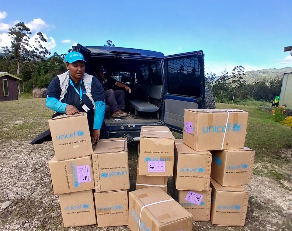 UNICEF-supported Dignity Kits are off-loaded at the Mulitaka Health Center, walking distance to the disaster site in Enga province, Papua New Guinea, on May 25.