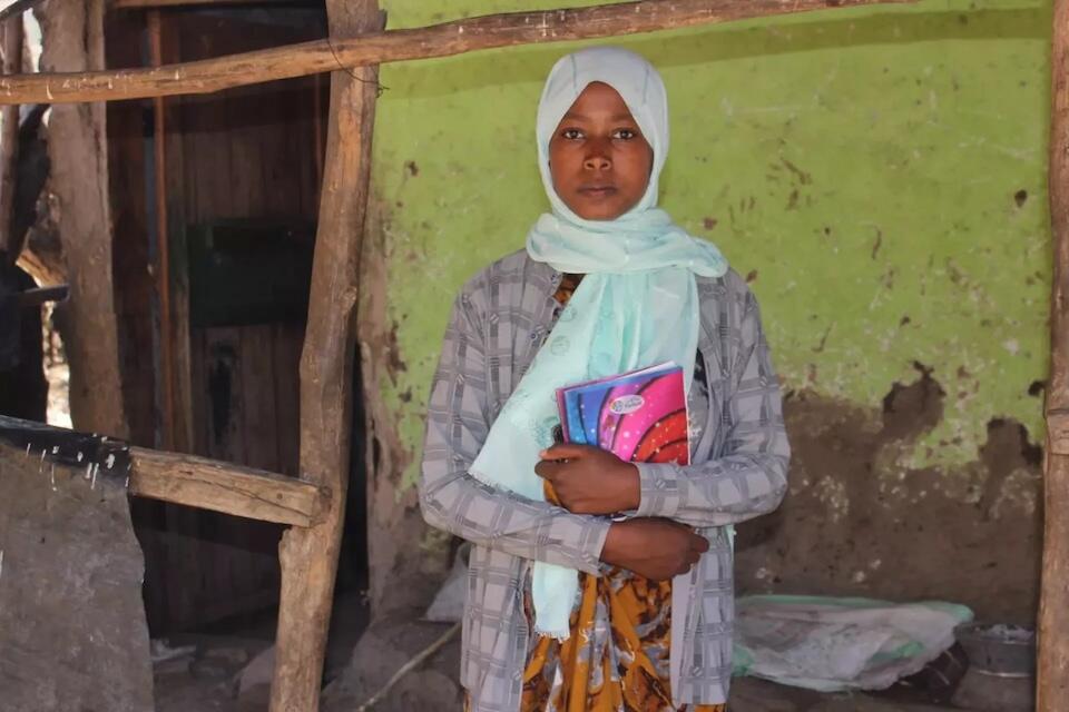 Fatuma, 15, an 8th-grade student at Weledi Primary School in Nesim Shekila Kebele, Dawa Chafa Woreda, Amhara Region, Ethiopia, escaped an early marriage with help from a UNICEF-supported social service worker.