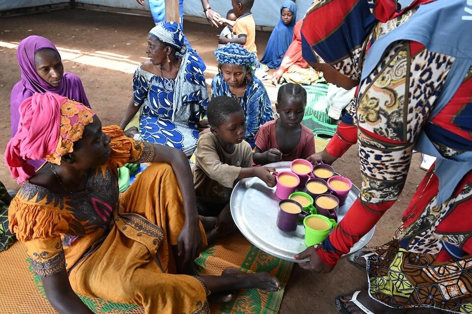 Children receive a nutritious meal after a cooking demonstration at the Gado Badzere site in Garoua-Boulai in the East Region of Cameroon.