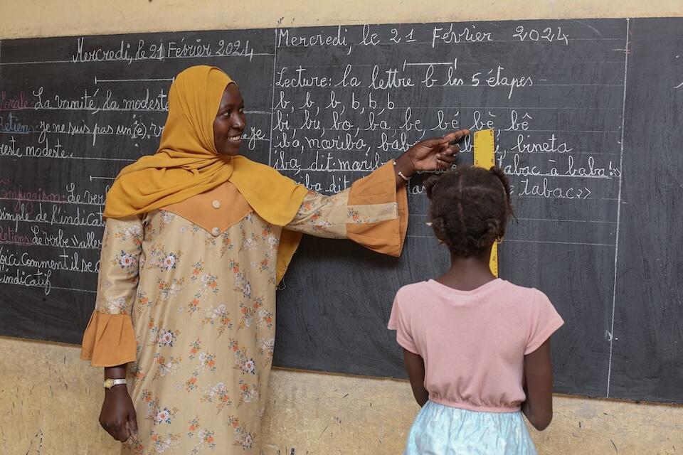 Salamata, 9, is invited to the chalkboard to demonstrate her work at Mahamane Fondogoumo School in Timbuktu, Mali.