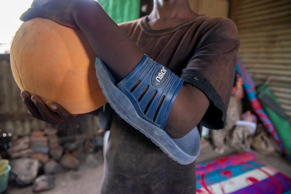 In Gedaref, Mohammed, 13, improvised an elbow pad from a sandal at a camp for people internally displaced during Sudan's civil war. 