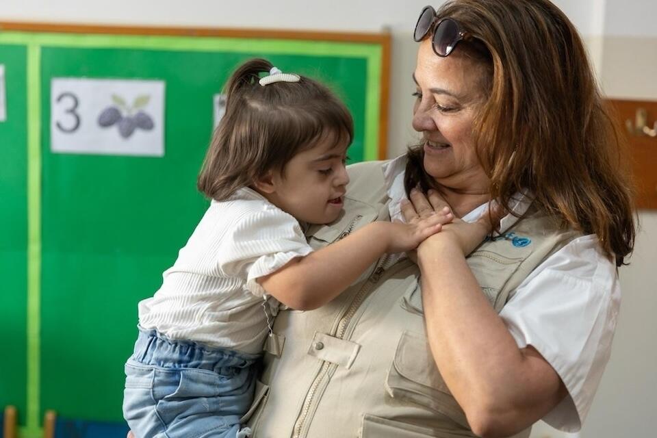 UNICEF USA's Darla Silva meets Razzelle, who attends a UNICEF-supported program for children with disabilities in northern Lebanon.