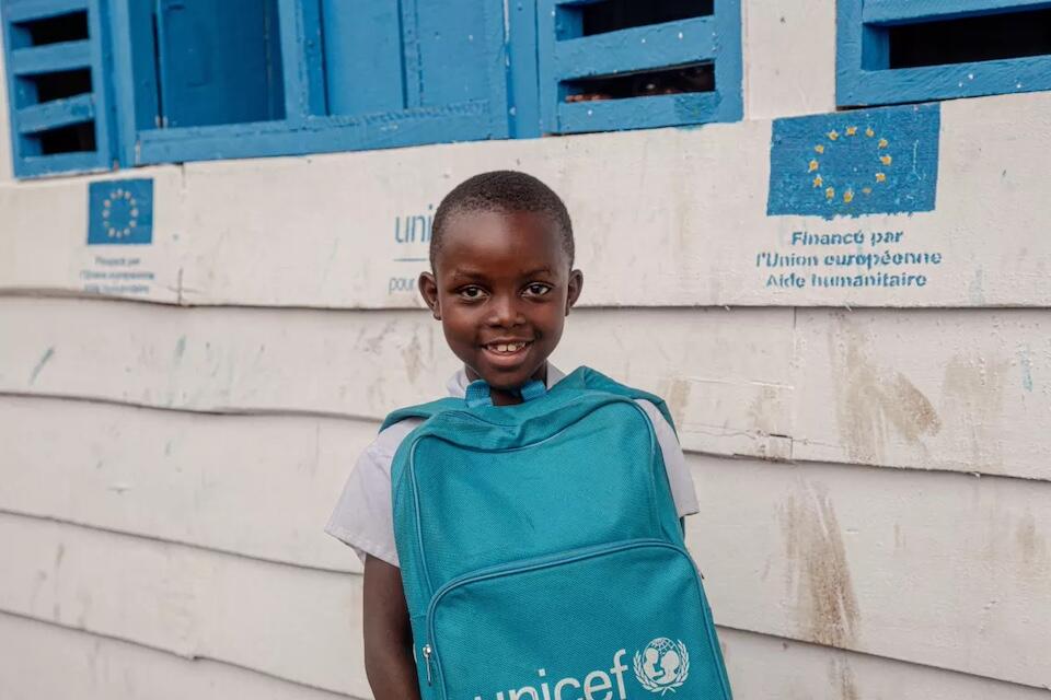 7-year-old Merveille leaving class outside the Temporary Learning Centre set up by UNICEF at the Bujari site for displaced people in North Kivu province, DR Congo,