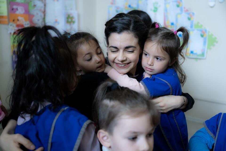 Children welcomed Aria Mia Loberti to a UNICEF early childhood learning space during a visit to Kosovo,