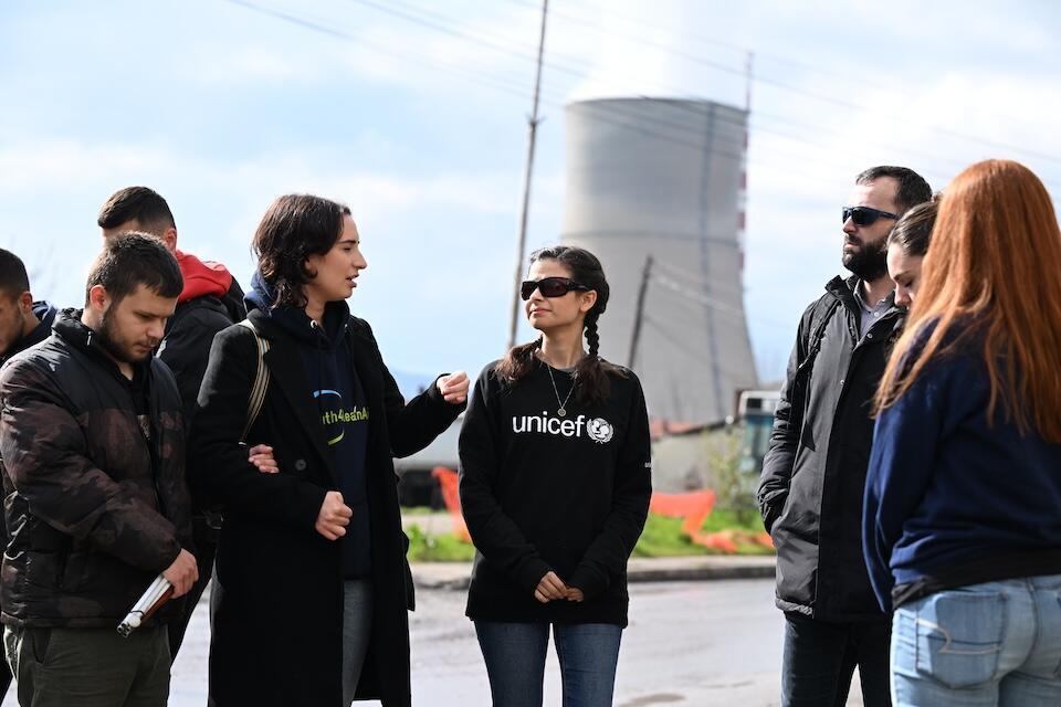 Near a coal-fired power plant in Kosovo, Aria Mia Loberti, center, met with young activists who are raising awareness about the harmful effects of environmental pollution in their community.