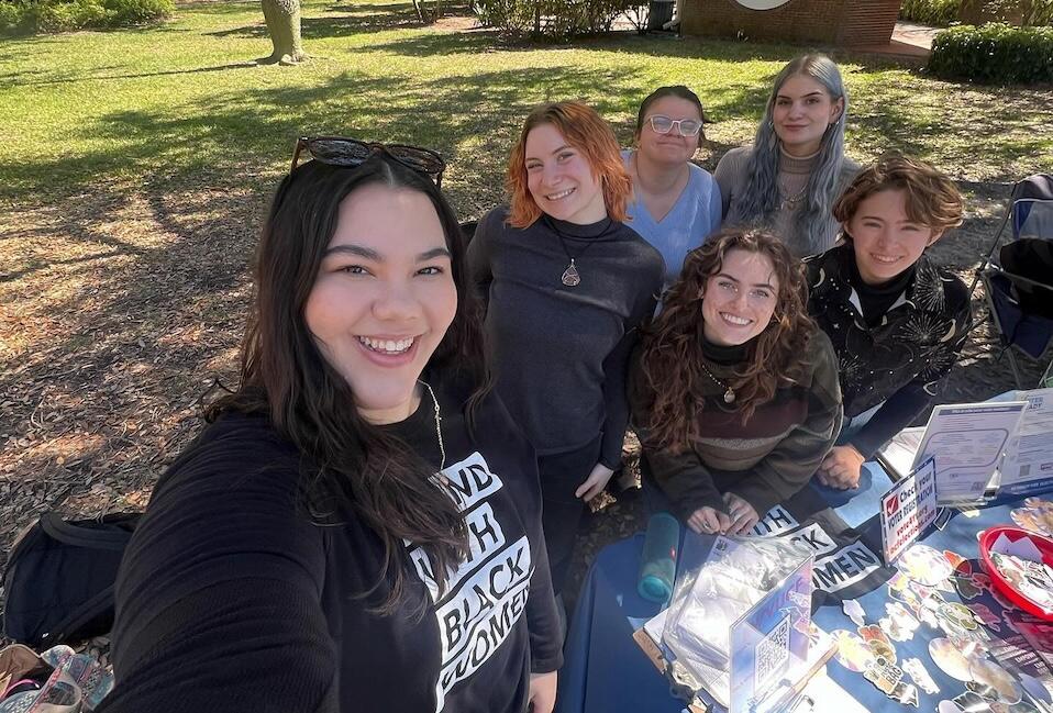 Victoria Shinker, far left, and club members tabling at University of Central Florida. 