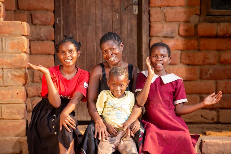 K.I.N.D. scholarship recipient Chisomo Diamon, far left, with her family in Malawi.