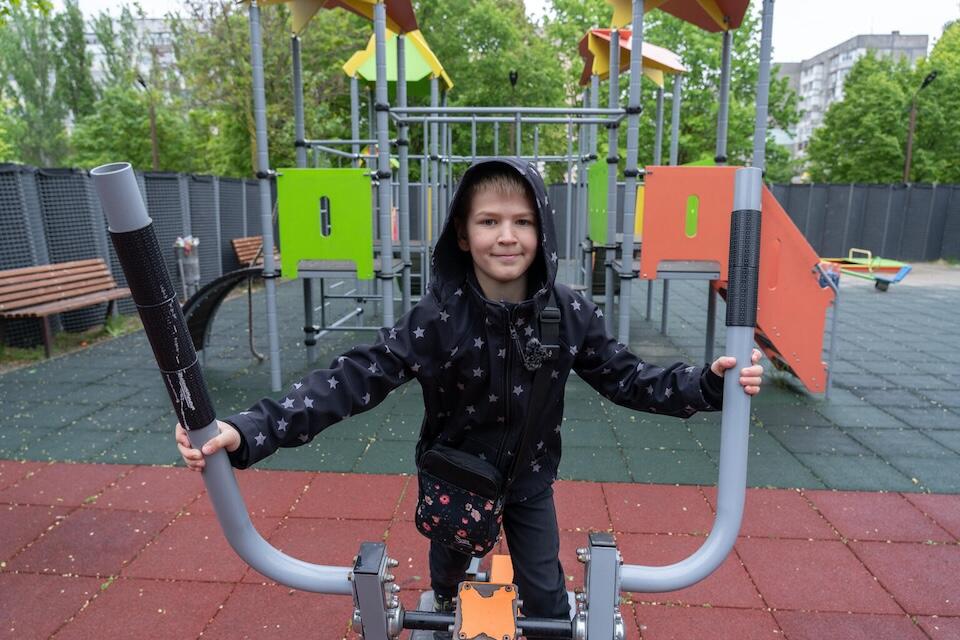 Andrii, 9, at the playground in Kherson, Ukraine.