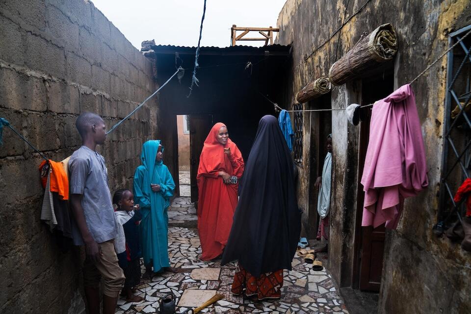 A volunteer community mobilzer visits the home of her brother’s family to encourage them to allow their daughter to receive the human papillomavirus (HPV) vaccination in Katsina, Nigeria.