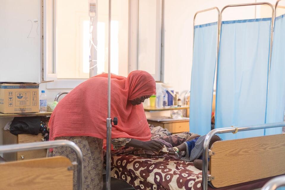 Samah looks after her 8-year-old daughter, Fatima, at Aljekaika hospital in northern Sudan.