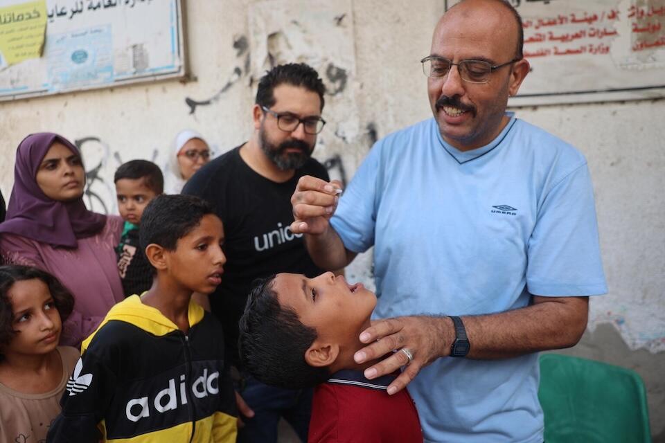 Health workers begin administering polio vaccines at the Az Zawayda Clinic in the central Gaza Strip.