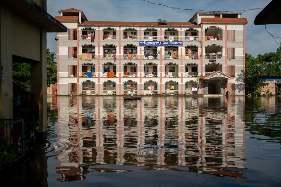 Families forced to evacuate their flooded homes found shelter in this school building in Ramgati, Chittagong Division, Bangladesh.  