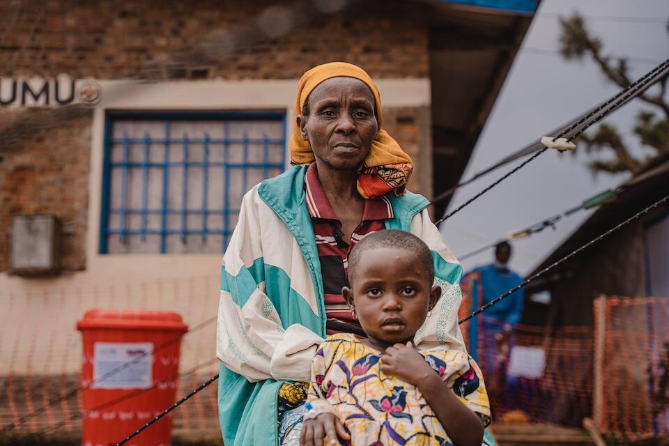 Ahana, 3, and her mother Jacqueline sit outside the UNICEF-supported mpox treatment unit at Kavumu Hospital in South Kivu province, DR Congo, on Sept. 6, 2024.