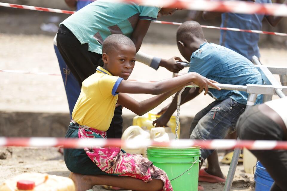 A girl at the water point at a UNICEF-supported IDP site in Mubimbi, Burundi. 