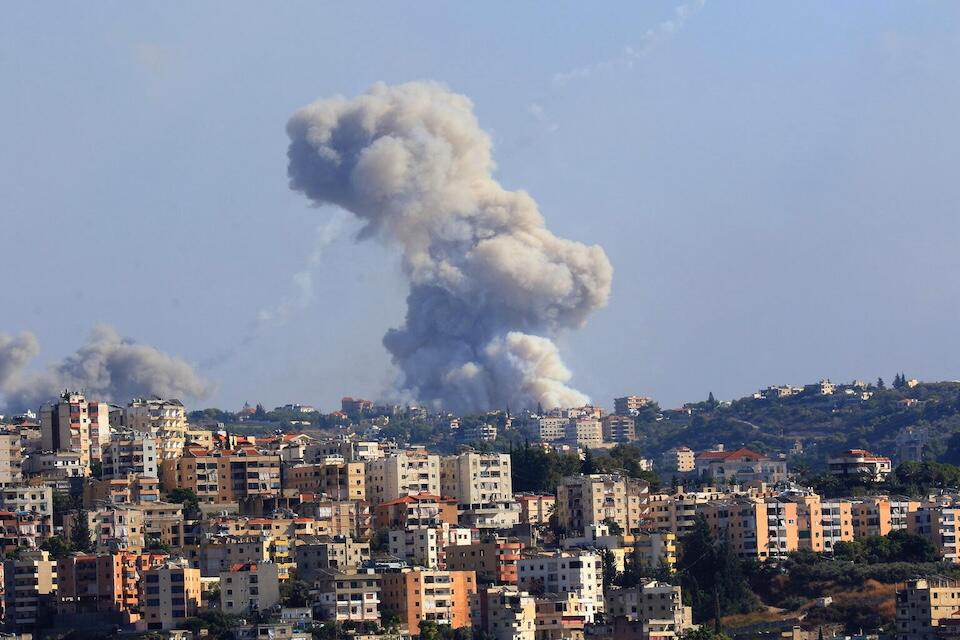 Smoke billows from a site targeted by shelling in the southern Lebanese village of Zaita on Sept. 23, 2024. 