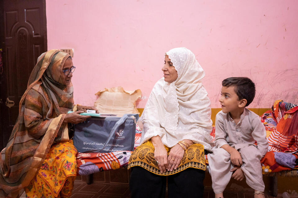 A 4-year-old in Pakistan facing the challenge of stomach worms receives a visit from Lady Health Worker Fareeda Aashiq Hussain. 