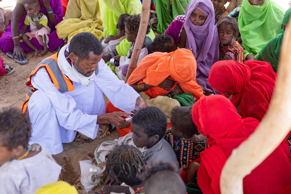 Mahmoud, a vaccinator and health worker, and his team vaccinate children during the door-to-door polio vaccination campaign in Barqiq valley in Sudan. The valley located behind the mountains, is more than 40 kilometers away from the nearest healthcare facility in Agig. The trip starts with a long car ride that is followed by the use of camels and donkeys due to the impassable roads.