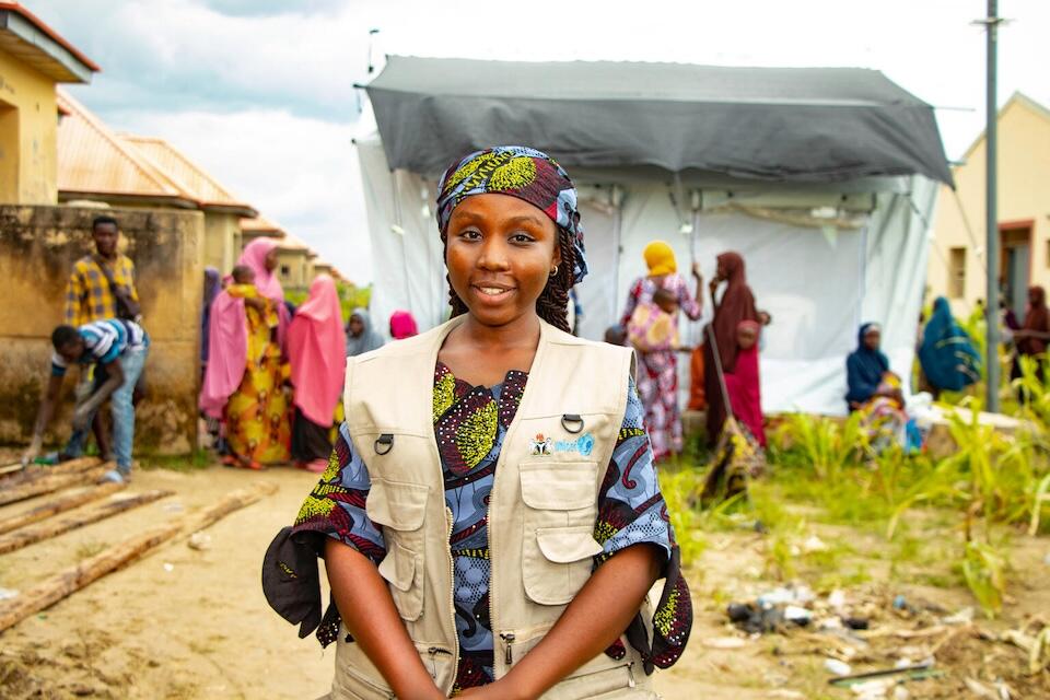 Martha Martins, a nurse and one of the 11 health care workers rapidly assigned to Bakassi camp by UNICEF, who was administering care to families, even though she herself had been affected by the floods.