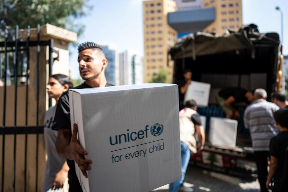 A man holds a box filled with UNICEF emergency supplies in Lebanon on Sept. 28, 2024.