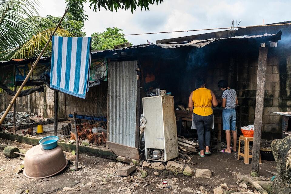 In Guatemala on Sept. 20, 2024, Luna, 17, and her mother make tortillas for lunch in their kitchen. 