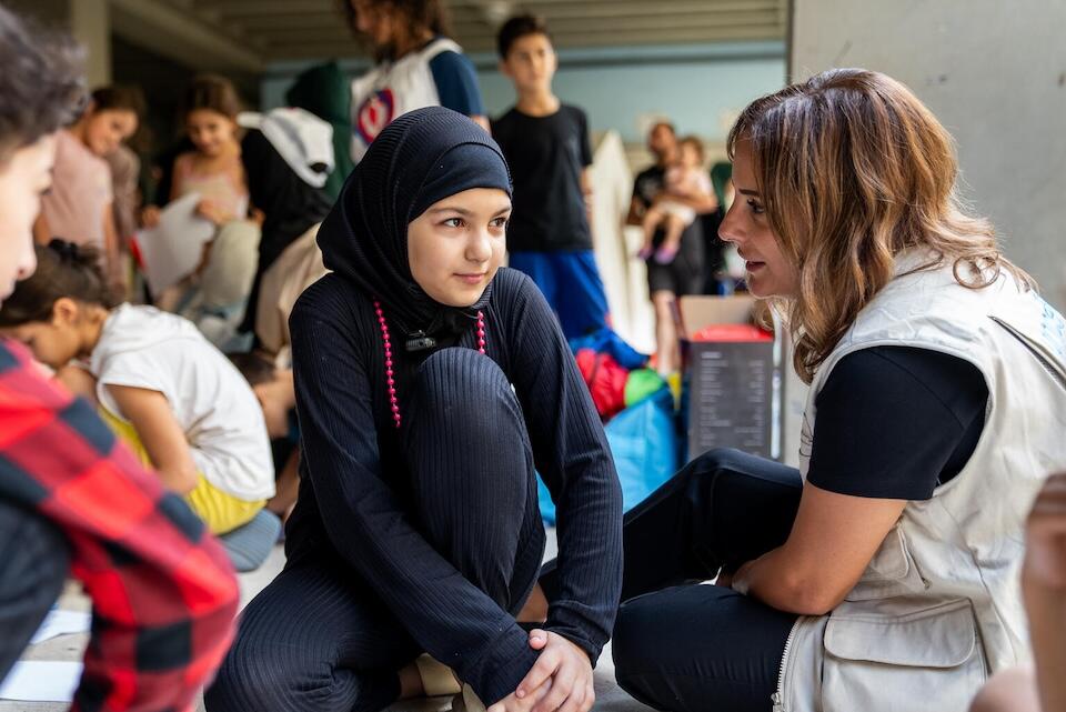 Zeinab, 11, whose home was destroyed following the bombing of her village in the south of Lebanon, attends a UNICEF psychosocial support session.