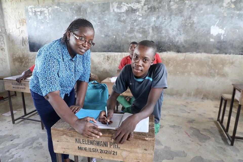 Mohamed, 17, with Ms. Catharine from WERK Kenya, the implementing partner supporting the back-to-school program in Tana River County, Kenya. 