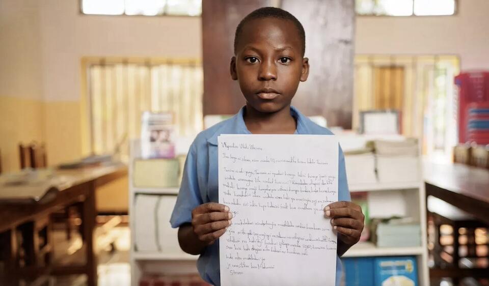 Steven, 10, of Tanzania writes a "Dear adults" letter as part of a UNICEF campaign for World Children's Day 2024.